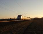 401 xxx fuhr am 09.03.15 im Sonnenuntergang durch Neu-Ulm.