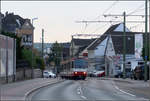 Die Stadtbahn als Straßenbahn -    Ein Stadtbahnwagen B80C/8 in der Marsbruchstraße in Dortmund-Aplerbeck wechselt von der Straßenfahrbahn auf den eigenen Bahnkörper kurz vor der