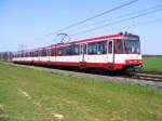 Eine Doppeltraktion aus Stadtbahnwagen B der Duisburger Verkehrsgesellschaft zwischen Froschenteich und Wittlaer im nrdlichen Dsseldorf als Zug der Linie U79 nach Dsseldorf-Oberbilk am 17.