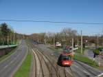 TW 2214 hat am 06. April 2010 mit einem weiteren unbekannten Wagen vom selben Typ, als Linie 3 Fahrtrichtung Holweide, die Haltestelle  Stegerwaldsiedlung  verlassen.