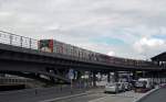 Zwei Triebzüge der Hamburger Hochbahn-Reihe DT3 verlassen am 01.07.14 den U-Bahnhof Baumwall in Richtung Wandsbek.