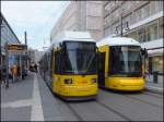 Zwei moderne Straenbahnen in Berlin am Alexanderplatz am 26.04.2013