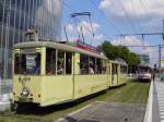 DWAG-Triebwagen T2 (Wagennummer 379, Baujahr 1950) mit DWAG-Beiwagen B2 (Wagennummer 643, Baujahr 1952) der Rheinbahn AG Dsseldorf. Aufgrund des  Blaulichttages  kamen an diesem sonnigen Tag mehrere historische Zge, als kostenloser Pendeldienst, zwischen Dsseldorf Hbf und D-Polizeiprsidium/Landtag zum Einsatz. 
Im Hintergrund ist ein DWAG GT8S (Wagennummer 3050, Baujahr 1975) zu erkennen, im Einsatz als Linie 704 nach D-Derendorf Nord. Dieser Wagen wurde wenige Wochen spter, nach einem Brandschaden, abgestellt.
Aufgenommen am 04.07.2009. Ort: Dsseldorf, Graf-Adolf-Platz.