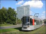 Niederflur-Straenbahnwagen 2108 der Rheinbahn vom Typ NF6 (Baujahr 1996), eingesetzt auf der Linie 703, hat gerade die Haltestelle am Jan-Wellem-Platz verlassen.