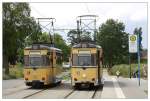 Tw 28 und Tw 32 der Woltersdorfer Straenbahn whrend einer Zugkreuzung an der Haltestelle Berliner Platz in Woltersdorf.