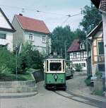 Straßenbahn Reutlingen__Tw 51 [ME 1928] mit Bw auf Linie 3 in der kurvenreichen Orstsdurchfahrt Rommelsbach.__Mai 1970