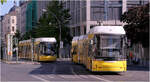 Begegnung in der Friedrichstra�e - 

... von Flexity Berlin 9014 links und 9081 an der Haltestelle Oranienburger Tor. Nur ein Stockwerk tiefer kann hier in die U-Bahnlinie U6 umgestiegen werden.

01.05.2026 (M)