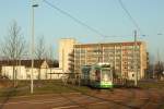 NGT6DE - Wagen 305 fhrt auf der Linie 3 der Dessauer Straenbahn der Endhaltestelle  Junkerspark  entgegen. Im Hintergrund ist das sogenannte  Mittelganghaus  des Stdtischen Klinikums zu sehen. 
Dessau, der 2.3.13 - 17.07 Uhr