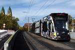 FREIBURG im Breisgau, 20.10.2019, Zug Nr. 276 als Tram4 zur Messe bei der Ausfahrt aus der Haltestelle Hauptbahnhof