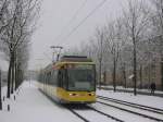 Niederflur-Straenbahnwagen 317 ist am 04.03.2006 als Linie 1 im Karlsruher Stadtteil Oberreut unterwegs.