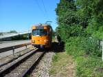 Straenbahn der OEG die zum rnV gehrt ist schon im neuen Orangeblauweisen Farbstil lackiert.