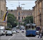 Aus drei Jahrhunderten - 

Mit dem Bau der Münchener Maximilianstraße wurde 1853 begonnen, dass Maximilianeum (im Hintergrund) wurde 1874 fertiggestellt, der Straßenbahnwagen vom Typ M, der hinter dem Maxmonument quert, wurde von 1950 bis 1965 gebaut, der Typ P von 1963 bis 1969. Die Personen wurde ebenfalls im letzten Jahrhundert geboren, während die Autos eher aus dem 21.sten Jahrhundert stammen. 

17.06.2012 (J)