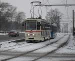 Tatra-Straenbahn vom Typ T6A2 mit Bildern von Zeitungsausschnitten ber den Mauerfall fhrt als Linie 1 von Rgener Str.,Rostock Richtung   Hafenallee, Rostock Aufgenommen am 20.02.10 in Hhe