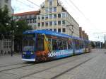 Rostock am 28.08.2012.
Ein - NGT - der Rostocker Verkehrsbetriebe,mit
sehr geschackvoller Eigenwerbung,
kurz vor Erreichen der Station   Neuer Markt  .
Im Hintergrund das   Hotel zur Sonne  
