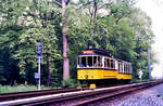 Sonderfahrt auf den Gleisen der früheren Filderbahn: Historischer Zug (TW 418 und BW 1241 SSB) zwischen den Stationen Landhaus (Möhringen) und Plieningen im Waldstück (31.05.1984)
