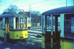 SSB Stuttgart__Endstation. Bf S-M�hringen, Schrottgleise. Blick zwischen Bw 1339 und 1376 hindurch auf GT4 459 auf Linie 31.__1970