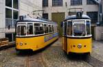 Zwei Fahrzeuge der Baureihe GRW 4 (MF Esslingen), TW 4 und TW 1, warten hier vor dem Straßenbahndepot der Ulmer Straßenbahn in der Bauhoferstraße  (Weststadt) auf ihre weitere Nutzung. Das Foto entstand am 29.09.1984.