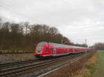 RE 21410 Hamburg Hbf - Lbeck Hbf rast am 27.12.08 zwischen Reinfeld (Holst.) und Lbeck Hbf seinem Ziel entgegen.