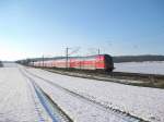 RE 21422 fhrt am 14.02.09 durch die verschneite Winterlandschaft bei Reinfeld (Holst.) Richtung Lbeck Hbf.