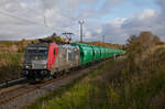 Akiem 186 373 für CD Cargo am 03.05.2023 mit einem Leergetreidezug von Mukran bei Lietzow.