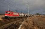 IGE/BLC24 mit LDK 155 059 und Leergetreidezug von Mukran am 17.01.2023 bei Samtens.