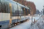 Seitenansicht, mit Blickrichtung Rehfelde: VT 733 (643 406) der NEB - Heidekrautbahn - steht hier im HP  Herrensee  als NE 26 und macht sich nach erfolgter Passagieraufnahme ber Strausberg nach