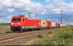 185 384-5 schleppt Container durch Hohenthurm Richtung Halle (Saale).