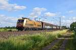 BRLL 185 597, vermietet an HSL Logistik, mit Saarrailzug Brake (Weser) - Neunkirchen (Saar) Hbf (Hüde, 19.06.2021).