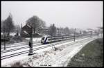 Ein Taurus schiebt am 24.1.2015 um 11.10 Uhr den aus einer kompletten NOB Garnitur bestehenden HKX 1807 nach Hamburg durch Lengerich. Im Hintergrund die ev. Kirche und rechts das Bahnbetriebswerk der TWE.