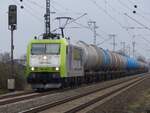 CAPTRAIN 185 548 mit Kesselzug am ehem. Bk Deves bei Salzbergen, 17.02.2024