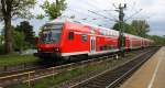 Ein RE4 von Aachen-Hbf-Dortmund-Hbf und am Zugende ist die 111 116 DB kommt aus Richtung Aachen-West,Laurensberg,Richterich, und fährt durch Kohlscheid und fährt in Richtung