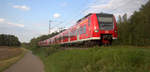 Die Rhein Niers Bahn (RB33) kommt aus Duisburg-Hbf,Heinsberg(Rheinland) nach Aachen-Hbf und kommt aus Rheydt,Wickrath,Beckrath,Herrath,Erkelenz,Baal,Hückelhoven-Baal,Brachelen,,Lindern,Süggerath,Geilenkirchen,Frelenberg,Zweibrüggen,Übach-Palenberg und fuhr in Richtung Finkenrath,Hofstadt,Herzogenrath,Kohlscheid,Richterich,Laurensberg,Aachen-West,Aachen-Schanz,Aachen-Hbf. 
Aufgenommen von einen Weg in Rimburg im Wurmtal. 
Bei Sonne und Wolken am Abend vom 10.9.2019.