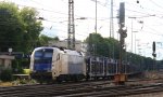 1216 953-0 von der Wiener Lokalbahn fhrt mit einem Autoleerzug aus Belgien nach Rumnien bei der Ausfahrt in Aachen-West und fhrt in Richtung Kln ber sterreich bei Sonne und Wolken am 8.7.2012.