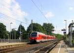 1428 004 DB kommt aus Richtung Aachen-West,Laurensberg,Richterich und fährt durch Kohlscheid und fährt in Richtung Herzogenrath,Mönchengladbach. 
In der Abendsonne am Abend vom 10.6.2015.