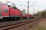 Zugbegegnung zweier RB in Mosel bei Zwickau, im Vordergrund 143 093-3 mit einer RB nach Dresden Hbf, im Hintergund eine RB mit 143 157-6 als Schublok nach Zwickau(Sachs)Hbf.25.04.2012