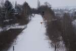 Blick von der Beuditzvorstadtbrcke in Weienfels auf die tief verschneite KBS 551 Richtung Zeitz.Im Bild gut zu erkennen,die ehemalige Unterfhrung der KBS 504,fr Zge die in Richtung Halle/Leipzig