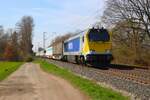 Stock Transport VOITH Maxima 40CC (264 003-5) mit VOGT Containerzug in Maintal Ost am 19.03.26