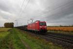 DB Cargo Bombardier Traxx 185 052-8 mit leeren Autotransportwagen in Klein Gerau am 29.10.20