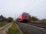 146 229 scheibt den RE 4708 durch die BK Basheide. Aufgenommen am 29.10.2009