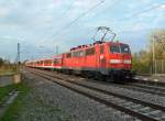 111 050-0 mit einer RB am 13.04.12 bei der Ausfahrt aus dem Bahnhof Buggingen.