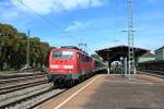 111 048-5 mit einer RB nach Neuenburg (Baden) am 14.08.12 bei der Abfahrt in Mllheim (Baden).