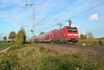 146 116-9 mit dem falschen Bgel und einem RE von Basel nach Offenburg am Nachmittag des 09.11.13 beim Verlassen des Bahnhofsbereichs von Mllheim (Baden).