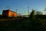 145 028-7 mit dem FIAT-Zug am spten Abend des 09.11.13 bei der Ausfahrt aus Mllheim (Baden).