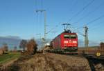 185 085-8 mit dem 44633 von Mannheim Rbf nach Basel Rbf/Muttenz am Nachmittag des 07.12.13 nrdlich des Bahnhofs Mllheim (Baden).