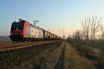 482 021-3 mit einem Kesselzug gen Norden im Abendlicht des 06.03.14 sdlich von Hgelheim.