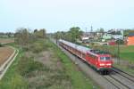 111 054 mit einer RB von Offenburg nach Neuenburg (Baden) am Nachmittag des 02.04.14 kurz nach dem Halt in Buggingen.