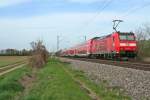 146 111-0 mit einem RE von Basel über Freiburg (Breisgau) nach Offenburg am Nachmittag des 02.04.14 südlich von Buggingen.