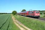 111 048-5 mit einer RB von Offenburg nach Neuenburg (Baden) am Nachmittag des 23.05.14 nrdlich von Hgelheim.