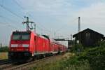 146 228-2 mit einem RE von Schliengen nach Offenburg am Morgen des 01.08.14 bei der Einfahrt in Auggen.