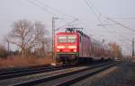 143 972 mit einer Verstrker-RB nach Neuenburg (Baden) am 08.03.11 kurz nach dem Halt in Buggingen.